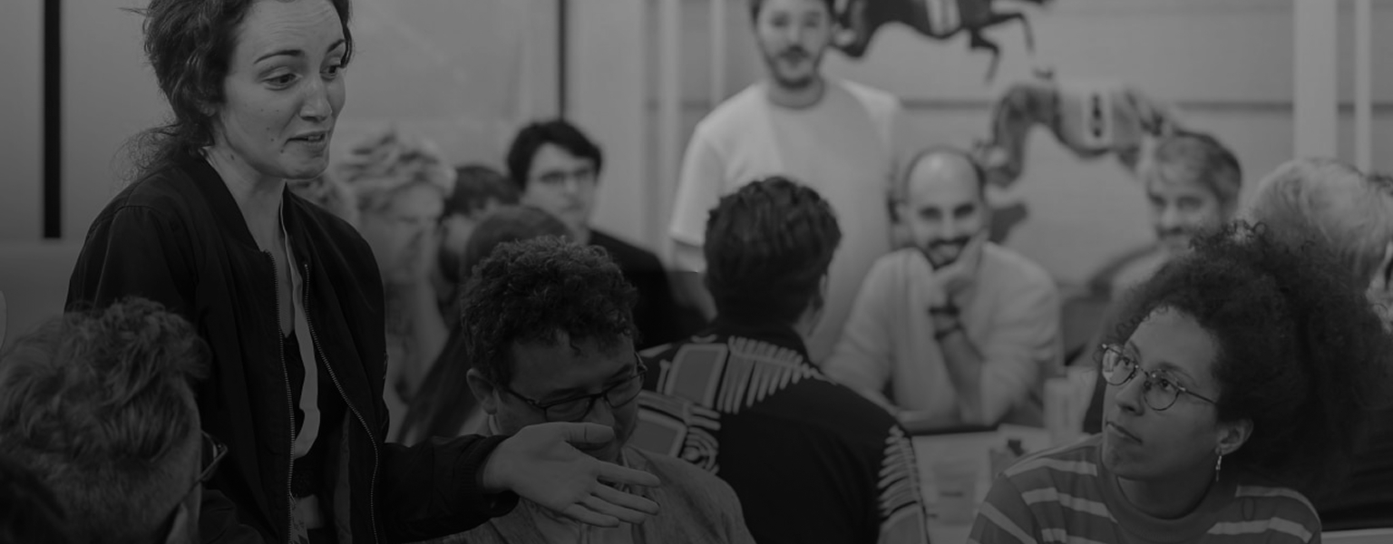 A footer banner depicting a focus group
